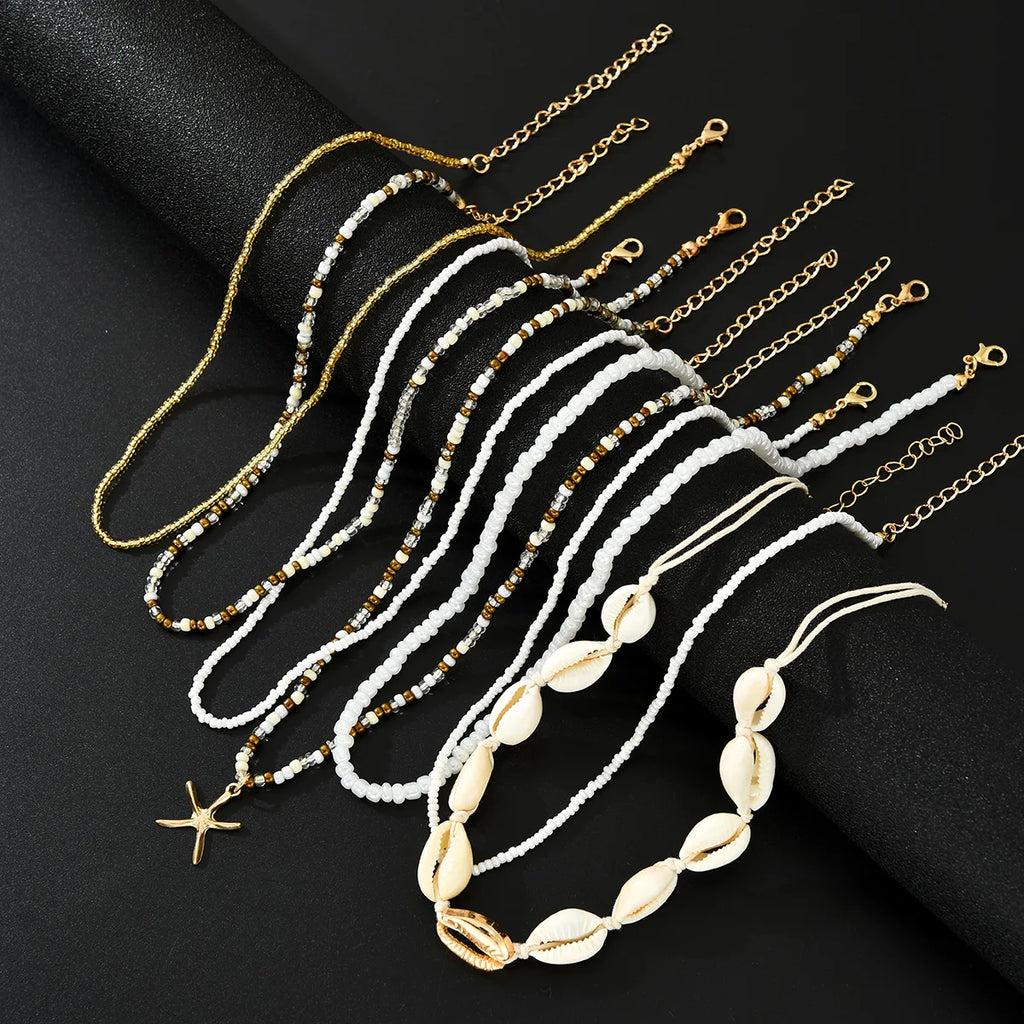7Pcs/Set Boho Starfish Conch Rice Beads Pendant Necklace for Women Fashion White Color Multi layered Necklace Set Summer Jewelry
