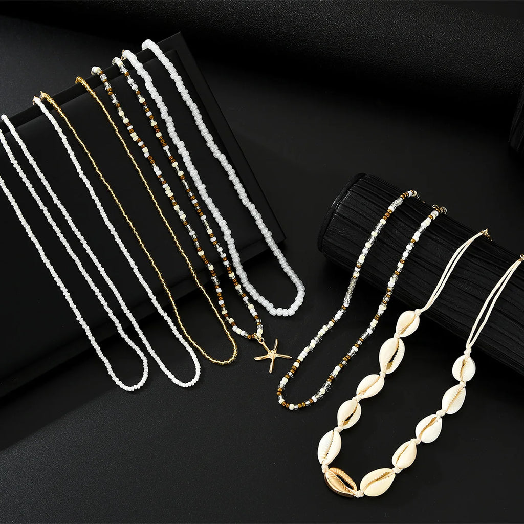 7Pcs/Set Boho Starfish Conch Rice Beads Pendant Necklace for Women Fashion White Color Multi layered Necklace Set Summer Jewelry